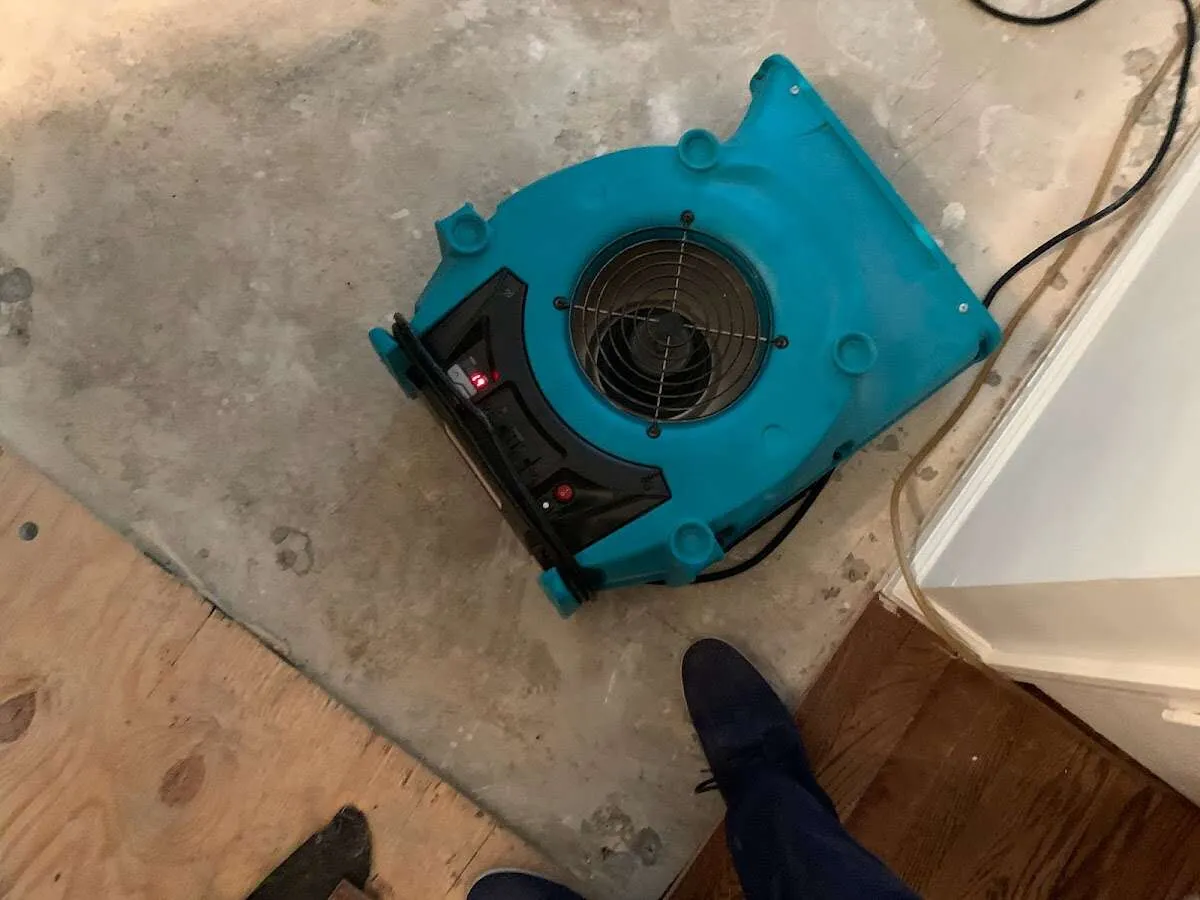 Air mover drying subfloor during Leak Detection & Repair in Coral Gables