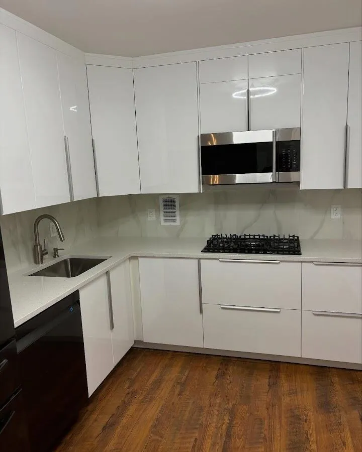 Restored kitchen with white cabinets after water damage in Coral Gables